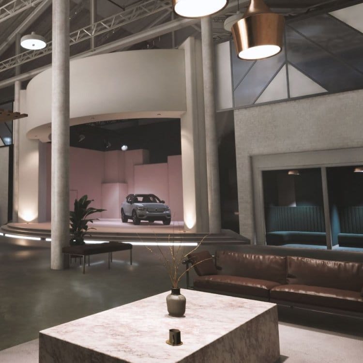 An industrial office with a car model on a small stage.