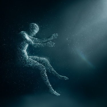 An animated person made out of particles floating in a sitting position. The person faces rays of light entering from the top right corner.